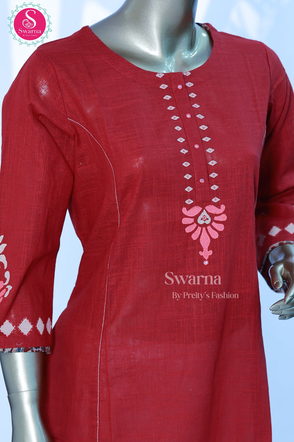 A graceful cotton top in a rich maroon shade with elegant printed detailing - SWRM069